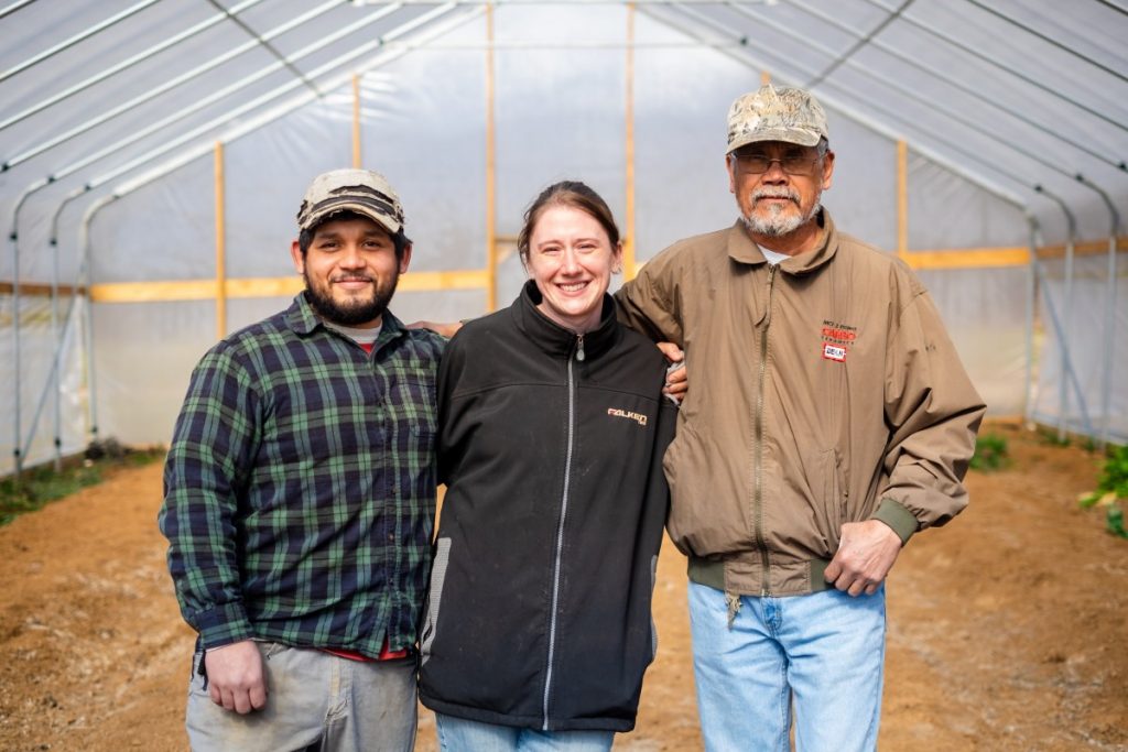 Salvador Moreno Jr., left, Alyssa Moreno, center, and Salvador Moreno Sr., right, own and operate SMM Farm in Western North Carolina. Photo: Aaron Dahlstrom/100 Days in Appalachia 