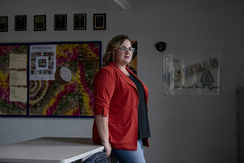 Jessica Salfia stands in her empty classroom at Spring Mills High School in Martinsburg, West Virginia, in August of 2020, five months after the novel coronavirus pandemic forced her to teach in an online classroom. Photo: Raymond Thompson Jr./Resolve Magazine