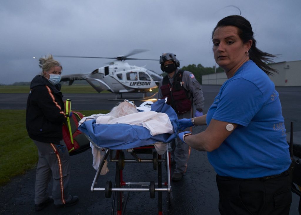 Alison Jeffers and Dallan Phillips work for Scott County Emergency Management Services. The local hospital, Big South Fork Medical Center, is severely underfunded and offers limited emergency services. Clara Terry is taken from the hospital to an air ambulance for a subdural hemorrhage. Photo: Stacey Kranitz/100 Days in Appalachia