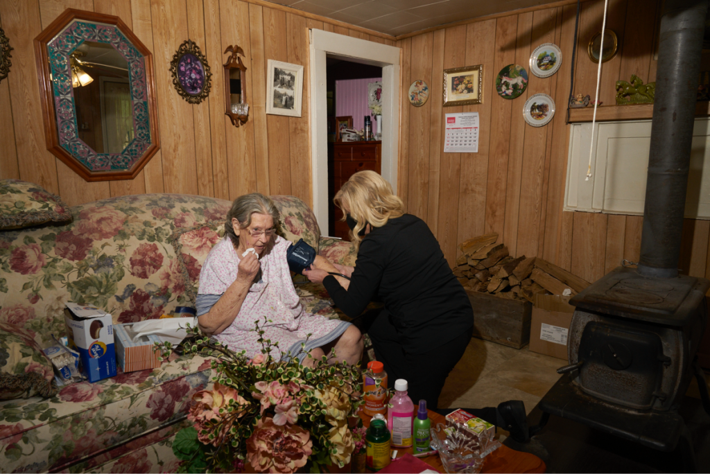 Dr. Teresa Tyson visits Shirley Sparks, 84, at her home in Wise County, Virginia. Shirley, who passed away this summer, lived alone and Tyson liked to stop by and check in on her. Photo: Stacy Kranitz/100 Days in Appalachia