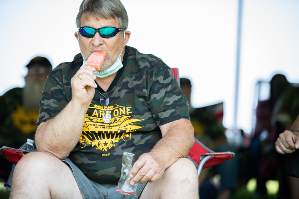 A member of the UMWA enjoys a Steel City popsicle during rally, passed out to help attendees deal with the summer heat. Photo: Quez Shipman/100 Days in Appalachia