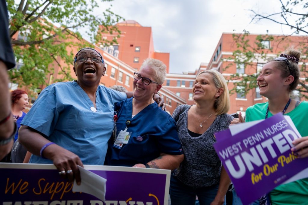 Healthcare workers gather for a group photo during a rally to support unionization efforts outside West Penn hospital on August 3, 2021. Photo: David Smith/100 Days in Appalachia