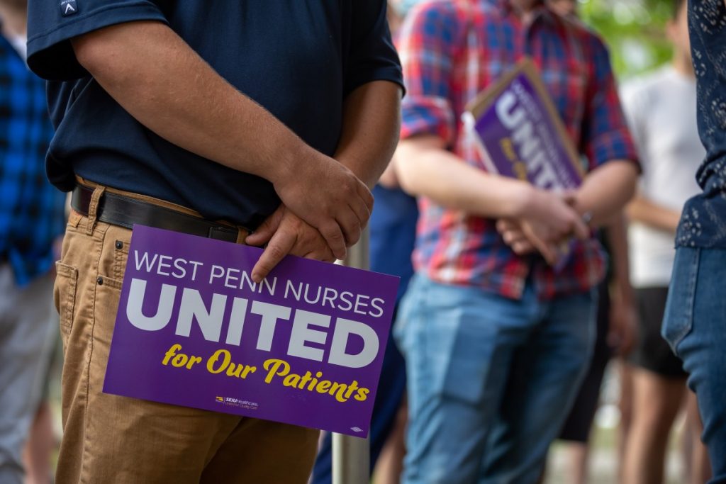 People hold signs in support of West Penn nurses’ union organization campaign during a rally outside the hospital on August 3, 2021. Photo: David Smith/100 Days in Appalachia